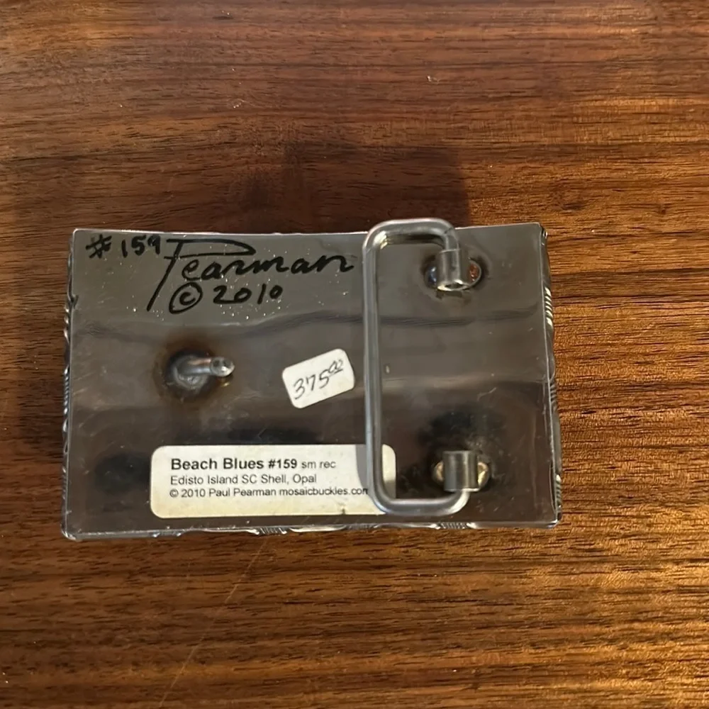 - Paul Pearman signed and numbered belt buckle. Beach BLues “159
